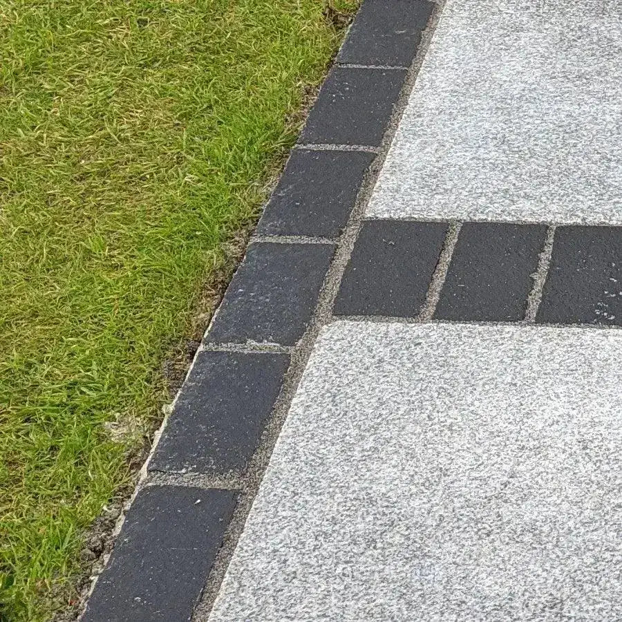 black limestone cobbles edging