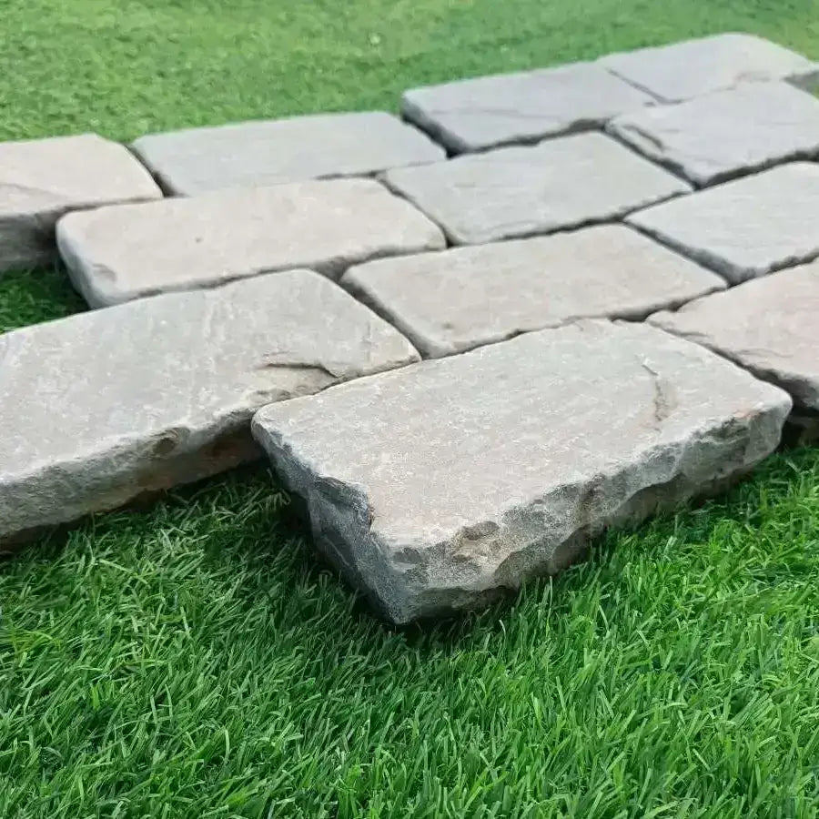 tumbled Kandla grey sandstone cobbles