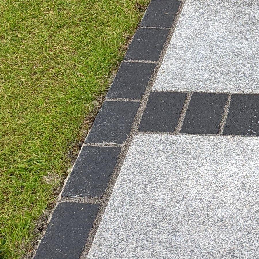 black limestone cobbles edging